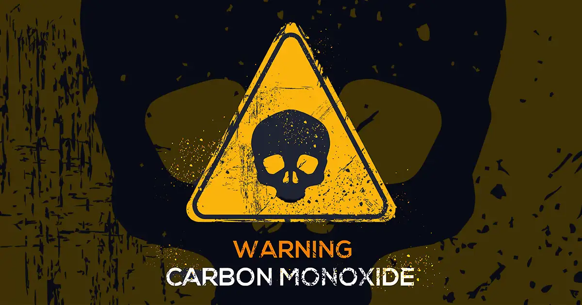 Warning sign for Carbon Monoxide featuring yellow triangle with a black skull