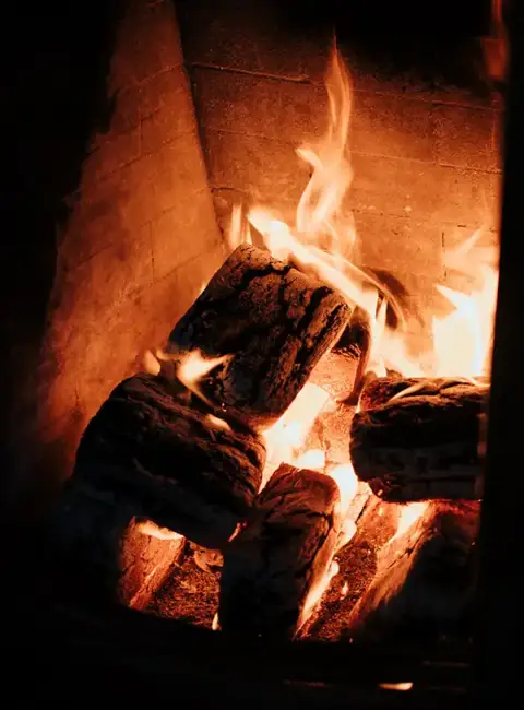 Slow burning fire in a fireplace, which can result in production of carbon monoxide.