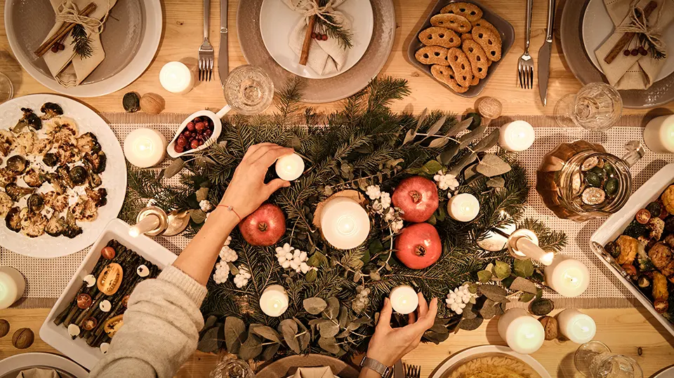 Decorating the table for the Christmas feast.